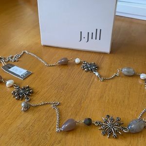 Costume jewelry.  Long necklace, silver-toned, winter-themed